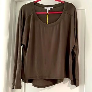 BCBG 0live green top. Longer in back. New.